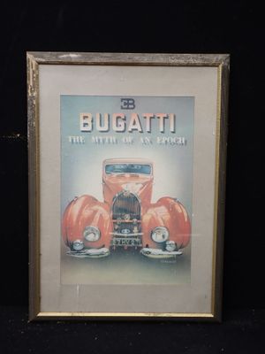 photo encadrée d'une publicité pour Bugatti avec une voiture de collection en arrière-plan
