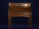 an antique writing desk with a wooden top and gold leaf decoration
