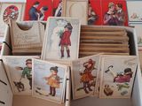 many cards in a box with pictures of people on them