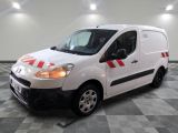 a picture of a white van parked in a garage