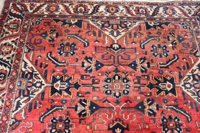 an image of a large oriental rug on a wooden floor