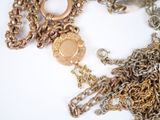 a lot of chains that are laying on a table