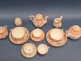 many different types of tea and coffee sets on the table
