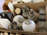 a box full of silver and silverware on the floor