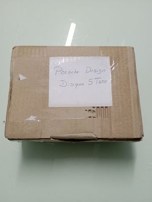 a cardboard box with a sign on it sitting on a table