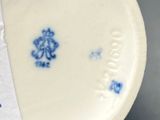 a white plate with a blue design on it