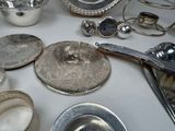 a table with a lot of silver items on it