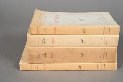 three books are stacked on top of each other on a table