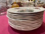 a lot of plates stacked on top of each other on a table