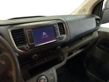 a dashboard of a car with a digital display in it