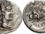 a silver coin with an image of a woman on it