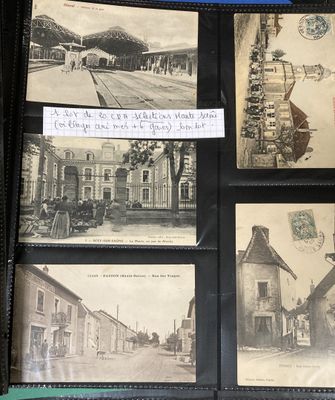 pictures of old postcards on display in a black case