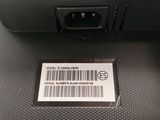 a barcode on the back of a cell phone that is sitting on a table