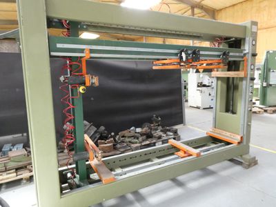 a machine that is working on a piece of wood