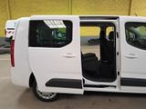 a white van with its doors open in a parking lot