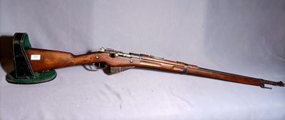 an old wooden rifle on a white background with a green hat