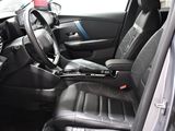 a picture of the interior of a car with a steering wheel
