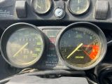 two gauges on the dashboard of a motorcycle
