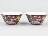pair of red and white bowls with floral designs on them