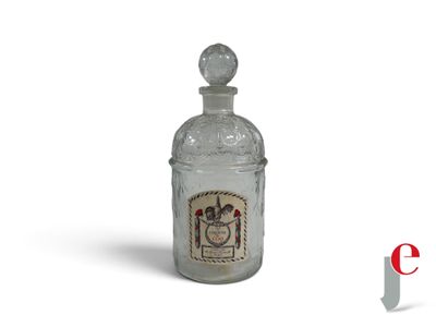 a glass bottle with a picture of a man on it