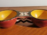 a pair of glasses sitting on top of a wooden table