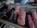 a suitcase filled with baby items and a stuffed animal