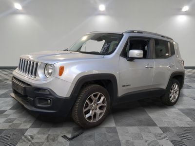 the jeep is parked in the garage on a checkered floor