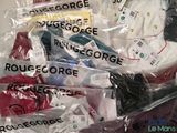 a pile of clothing wrapped in plastic bags on a table