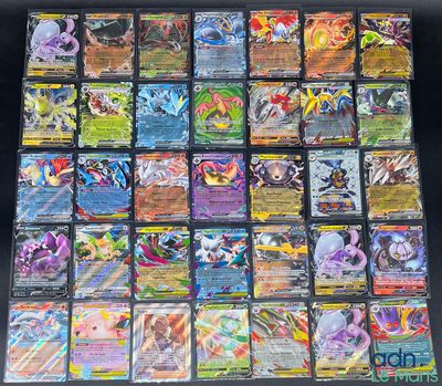 a close up of a bunch of pokemon cards on a table