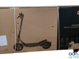 packaging of an electric scooter in a box on a white background