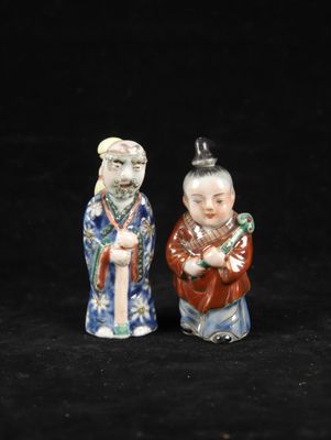 pair of chinese figurines of a man and a woman