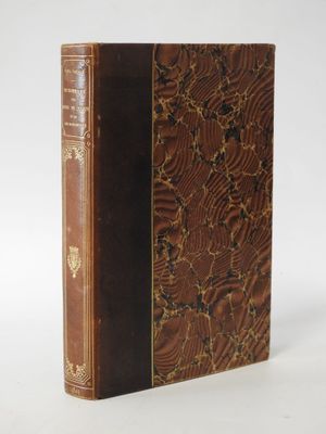 an old book sitting on top of a table next to a white background