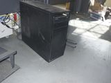 a black computer desk with a keyboard and mouse on it