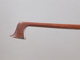 a close up of a wooden handle on a pair of glasses