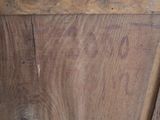 a wooden cabinet with a metal handle on it