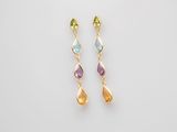 a pair of multicolored earrings on a white background