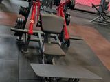 a gym with a lot of equipment on the floor