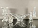 a lot of glass pieces sitting on a table