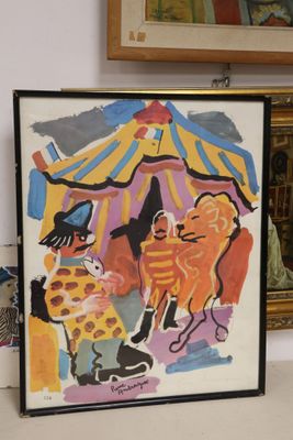 a picture of a picture of a clown and a cat on a table