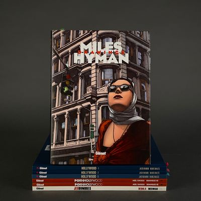 books are stacked on top of each other on a black surface