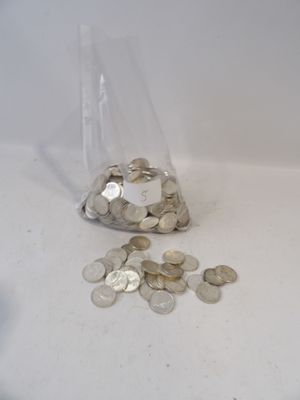 a bag full of coins sitting on a table