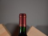 a bottle of wine that is sitting on a table