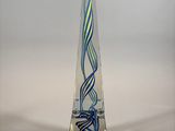 a blue and green glass sculpture on a clear base