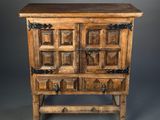an old wooden chest of drawers on a gray background