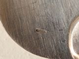 a close up of a metal spoon with a metal handle