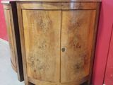 a small wooden cabinet with a door on the side of it