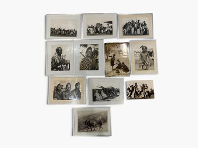 a lot of old black and white photos on the wall