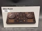 a close up of a dj controller in a box on a table