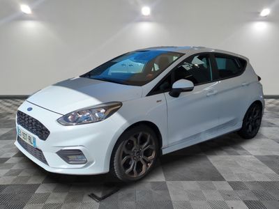 the white ford fiesta is parked on a checkered floor