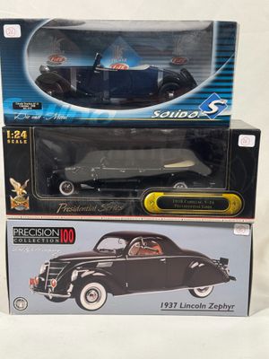 two boxed boxes of toy cars sitting on top of each other